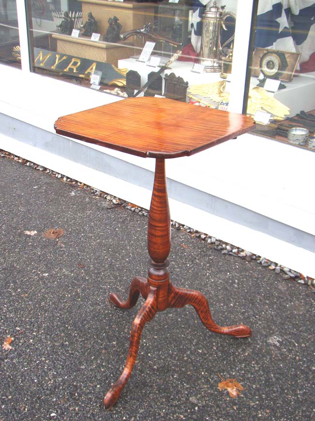 An exceptionally beautiful 18th century New England Chippendale style tilt-top candlestand in highly figured tiger maple circa 1770-1790.